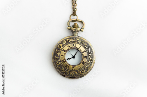 closed pocket watch on white background old