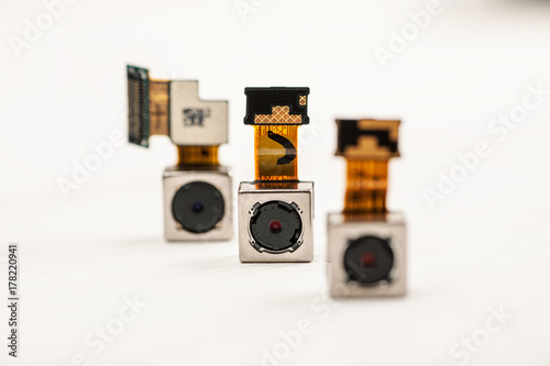 Obraz na płótnie Smartphone camera modules on a white background, closeup w salonie