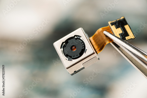 Fotografie Smartphone camera module in repair shop, macro shot