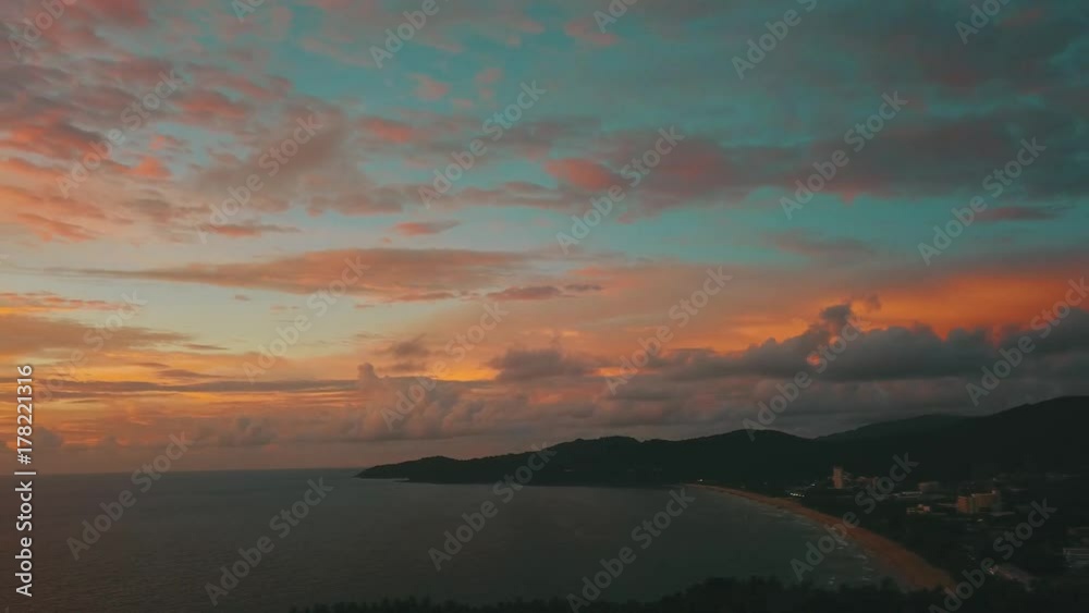 Aerial: Beautiful sea sunset with blue orange sky on tropical island Aerial: Beautiful sea sunset with blue orange sky on tropical island