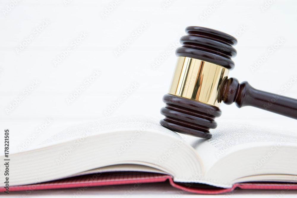 wooden gavel and books