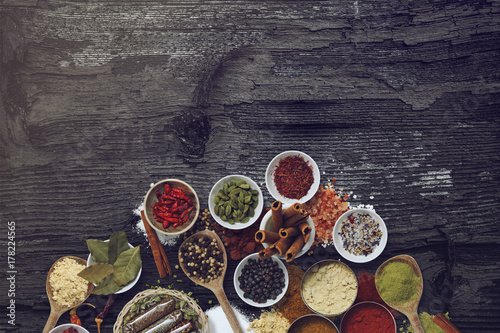 Various spices and powders on a wooden surface