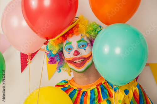 Bright cheerful clown. Birthday for children. Human emotions