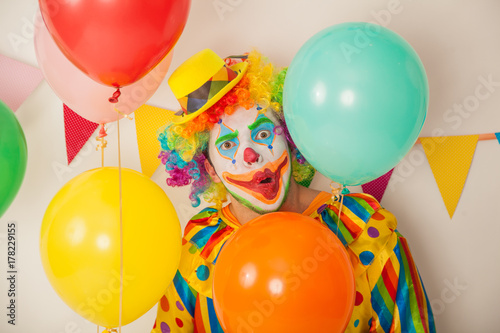 Bright cheerful clown. Birthday for children. Human emotions
