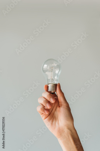 woman holding lamp in hand