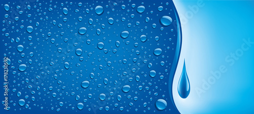 many water drops on blue background with place for text 