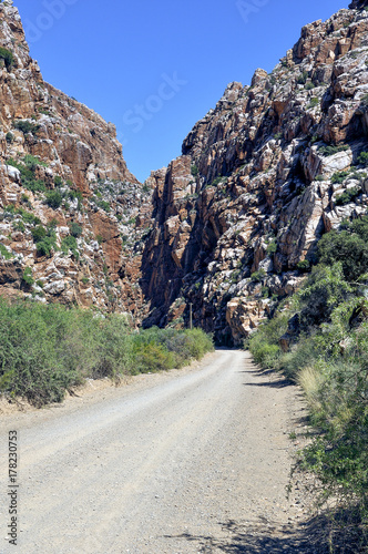 Dirt Road Leading to Between Rocky Hills