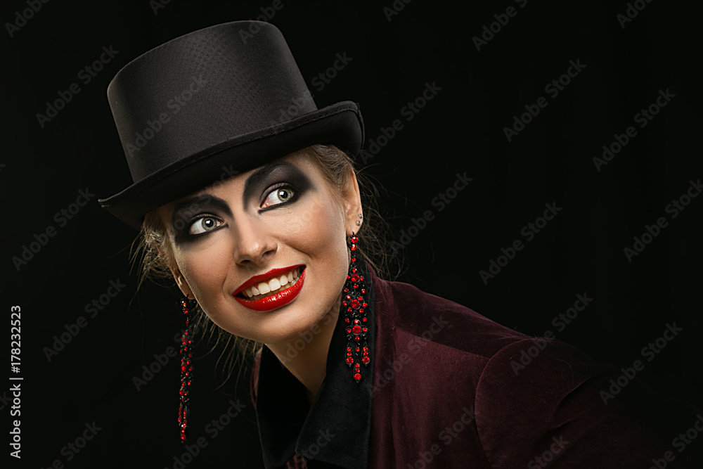Girl in hat with bright make-up on Halloween in the studio. Heavenly girl. Girl with earrings. witch Girl in hat with bright make-up on Halloween in the studio. Heavenly girl. Girl with earrings. witch