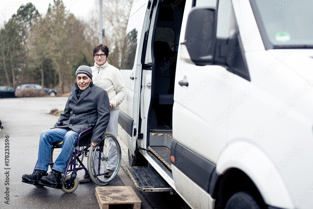 Nurse Helping Senior Man Exit A Van Nurse Helping Senior Man Exit A Van