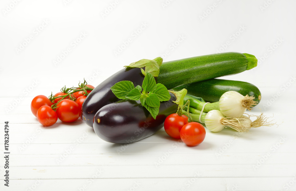 fresh eggplants, tomatoes, zucchini and spring onion