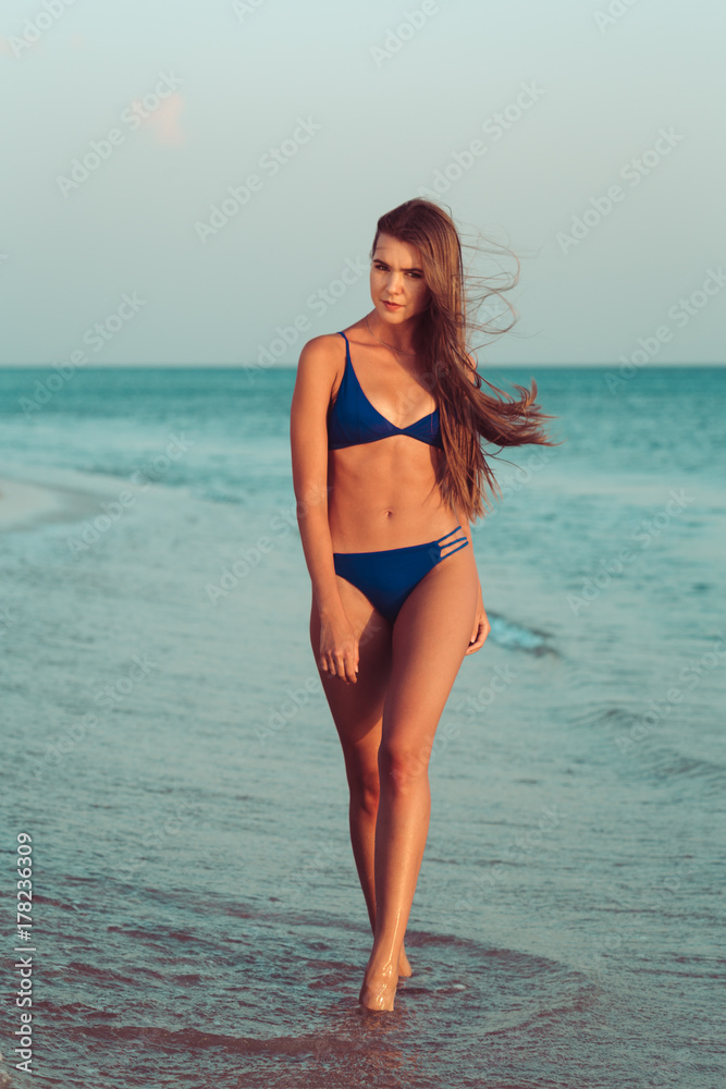 woman in bikini on beach woman in bikini on beach