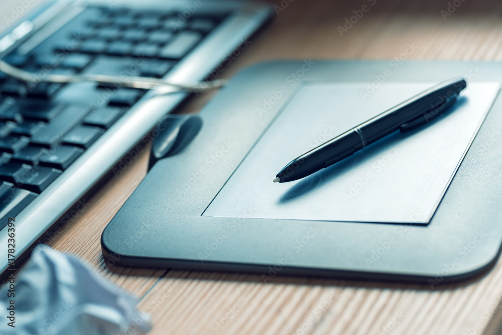 Graphic tablet and pencil on office desk Graphic tablet and pencil on office desk