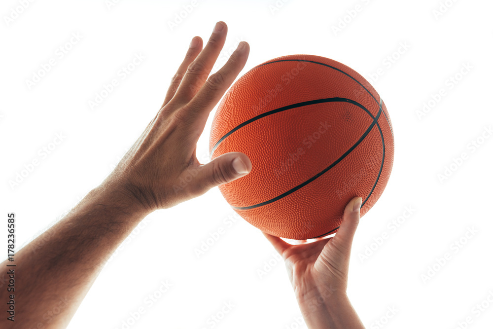 Fototapeta premium Man and woman playing basketball