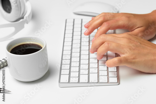 women's hands using keyboard and mouse
