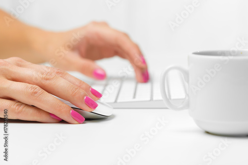 Woman's hands on a keyboard