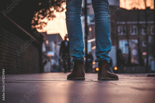 Worn boots on a busy street