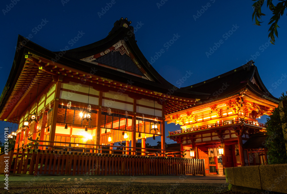 The red house or building and the entrance of Fushimi Inari Taisha where the great pillars or torii are lining in pattern which can be visited in Kyoto, Japan