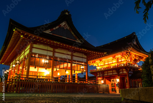The red house or building and the entrance of Fushimi Inari Taisha where the great pillars or torii are lining in pattern which can be visited in Kyoto, Japan