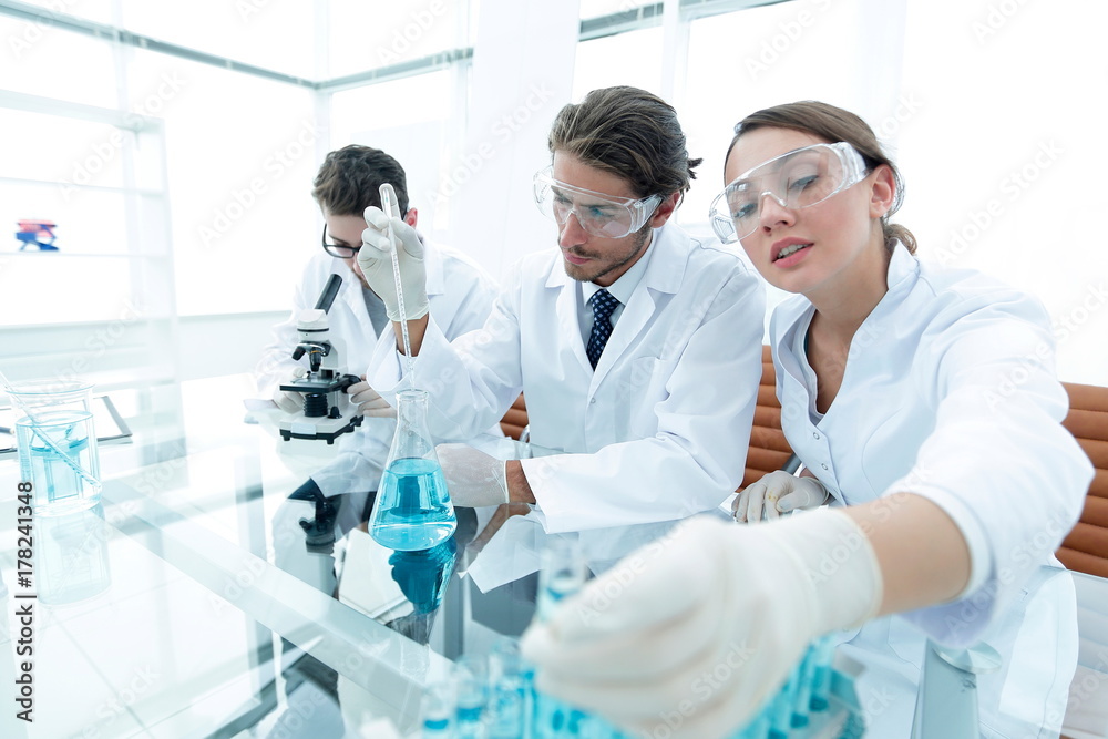 Scientist holding test tube or some equipment of science Scientist holding test tube or some equipment of science