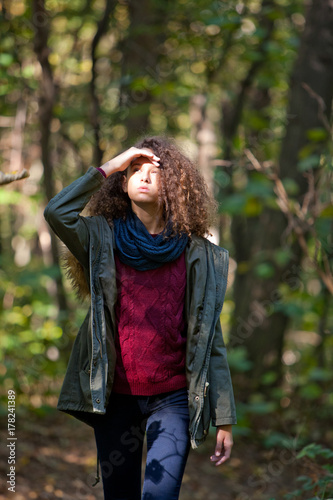 Teen girl in autumn forest