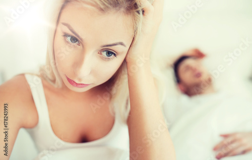 awake woman having insomnia in bed