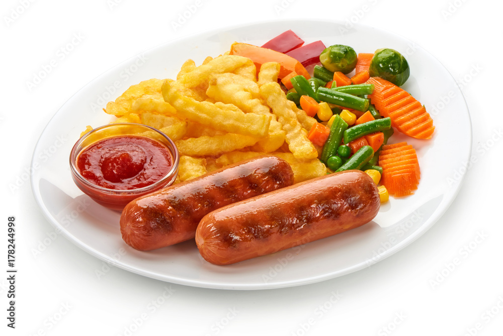 Grilled sausages with potatoes fries and vegetables, isolated on white background