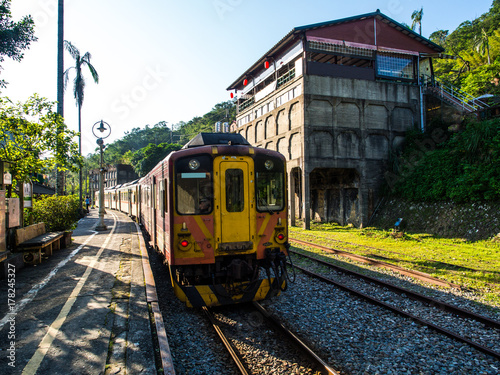 The old taiwanese train style for tourist to have some sight seeing moment of the nature toward Shifen waterfall. The moment is really nice, the vintage train with sunlight and shade on the railway