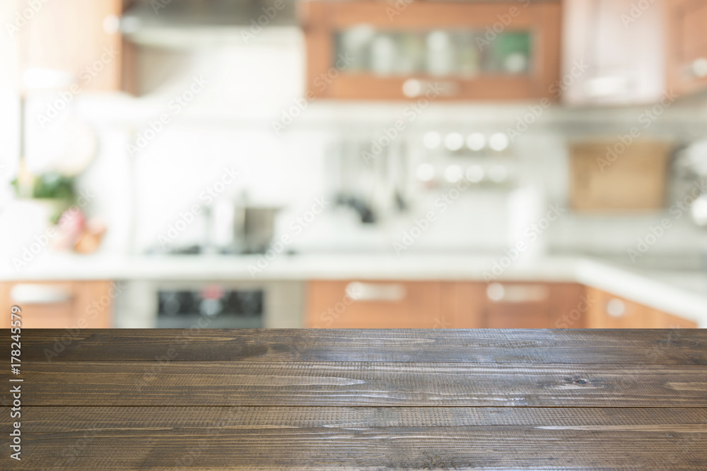 Blurred background. Modern kitchen with tabletop and space for you.