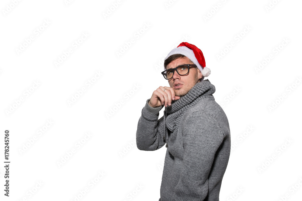 A Christmas guy in a gray sweater is smiling. On a white background A Christmas guy in a gray sweater is smiling. On a white background