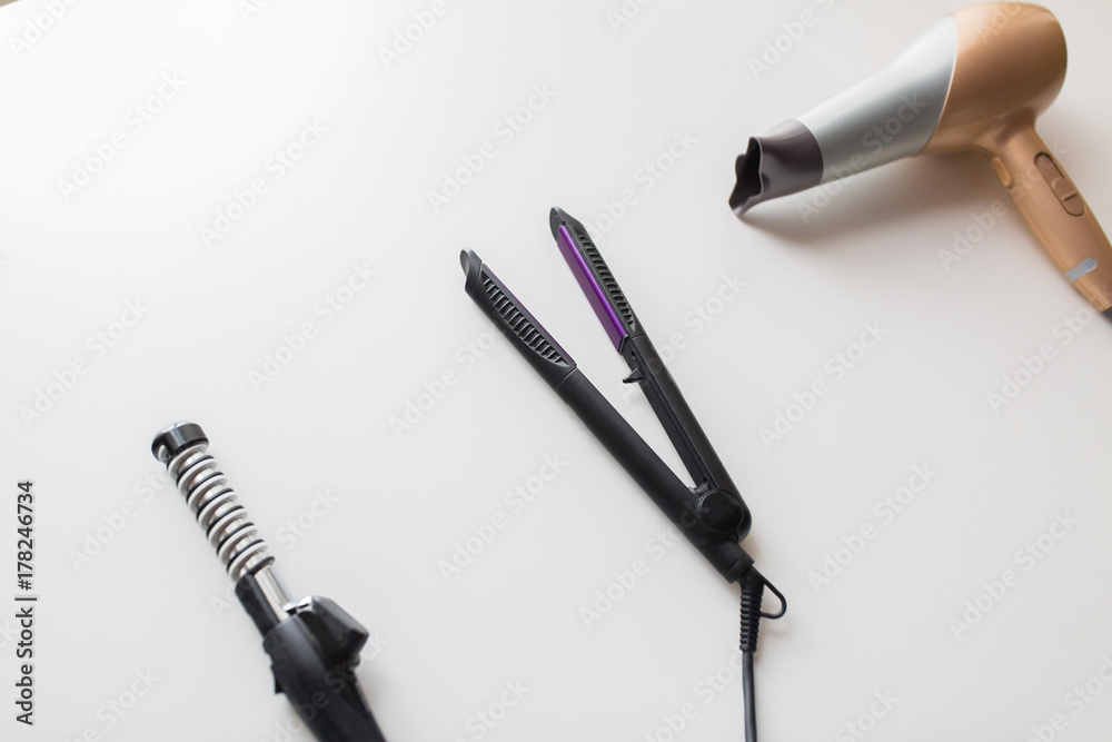 Naklejka premium hairdryer, hot styler and curling iron or tongs