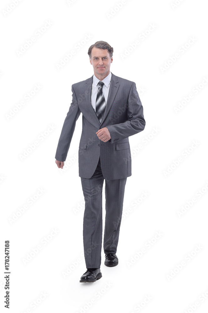 in all growth.a successful businessman, confidently striding forward. in all growth.a successful businessman, confidently striding forward.