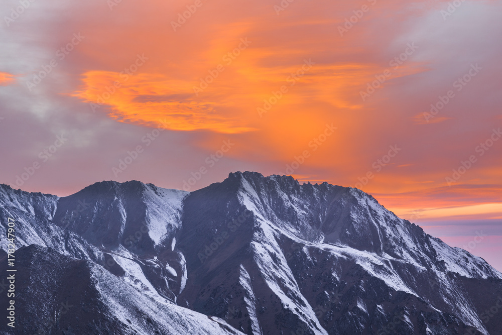 orange sunset over the mountain peaks