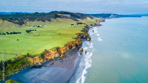 Aerial view on a dramatic Tasman coast line with cliffs and rocks near New Plymouth. Taranaki region, New Zealand.