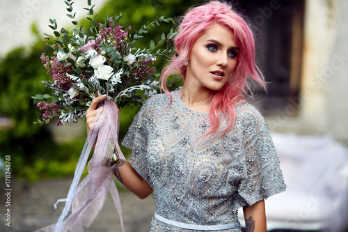 Stunning woman with pink ha...