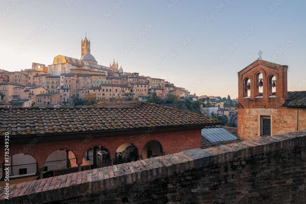 Beautiful panoramic view of the historic city of Siena at morning with an amazing lanscape on an idyllic summer morning, Tuscany, Italy