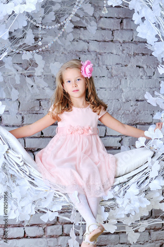 Happy smiling eight years old pretty blond caucasian child girl