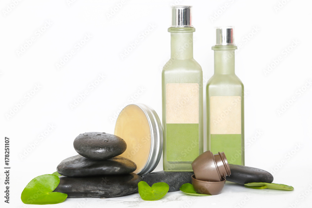 Cosmetic products arranged with zen stones Cosmetic products arranged with zen stones