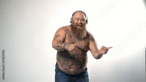 Man dancing while listening to music