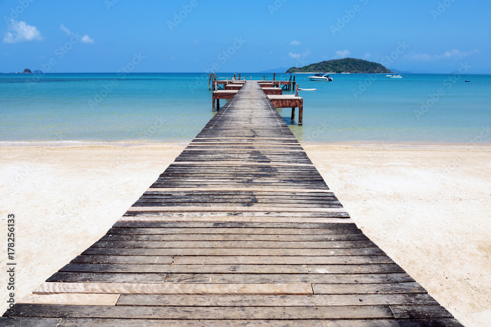 Old wooden jetty on exotic beach island, Thailand Old wooden jetty on exotic beach island, Thailand