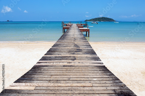 Old wooden jetty on exotic beach island  Thailand