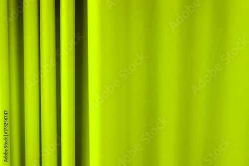 Background of a curtain of a green color