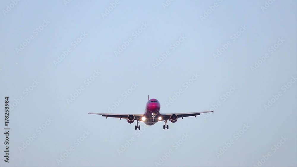 Big airplane of purple color approaching.
Large plane approaches up to pass above, with front view and blue sky.Slow motion. Big airplane of purple color approaching.
Large plane approaches up to pass above, with front view and blue sky.Slow motion.