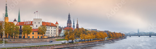 Waterfront of Daugava river and medieval part of old Riga at misty morning. Riga is the capital of Latvia and famous tourist site in Baltic region of Europe