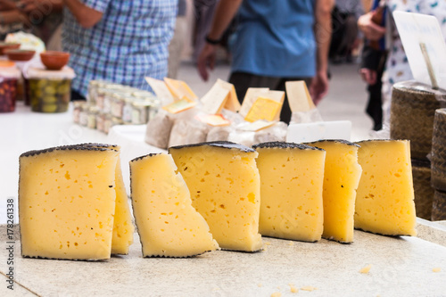 Manchego cheese for sale in the stall of Sineu market, Majarca, Spain