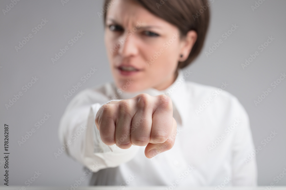 focus on a punch of an angry woman focus on a punch of an angry woman