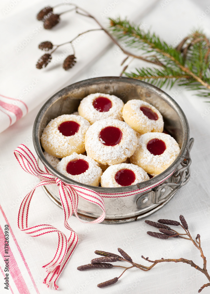 Homemade christmas cookies with raspberry jam filling in old metal cake baking pan. Homemade christmas cookies with raspberry jam filling in old metal cake baking pan.