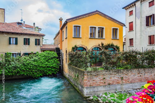 The northern Italian town of Treviso in the province of Veneto, it is located close to Treviso, Padua and, Vicenza. View of the city of Treviso Italy. Venetian architecture in Treviso, Italy. © Sid10