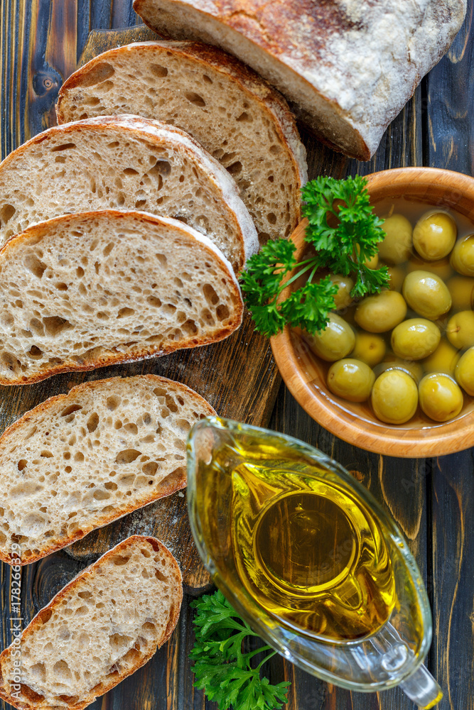 Homemade ciabatta with olive oil and olives. Homemade ciabatta with olive oil and olives.