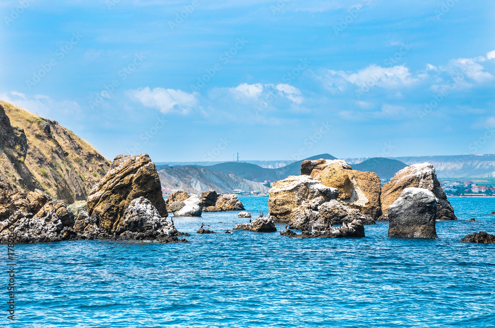 Seascape - rocks are washed by the black sea, birds on the rocks, Karadag Crimea Seascape - rocks are washed by the black sea, birds on the rocks, Karadag Crimea