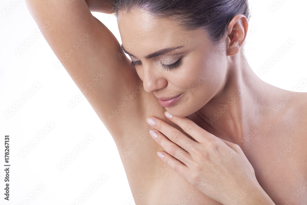 Close up of young woman showing her smooth armpit. Close up of young woman showing her smooth armpit.